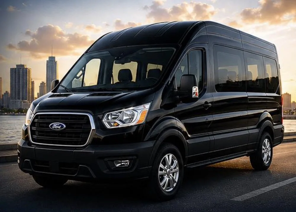 Prime Ride Shuttles black Transit van at the waterfront