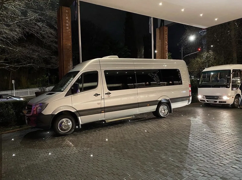 Prime Ride Shuttles vans staged for a night pickup